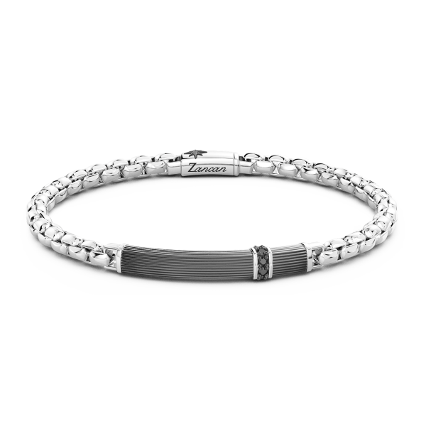 Bracciale in argento con scanalature e pietre.