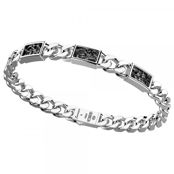 Silver bracelet with black decorations.